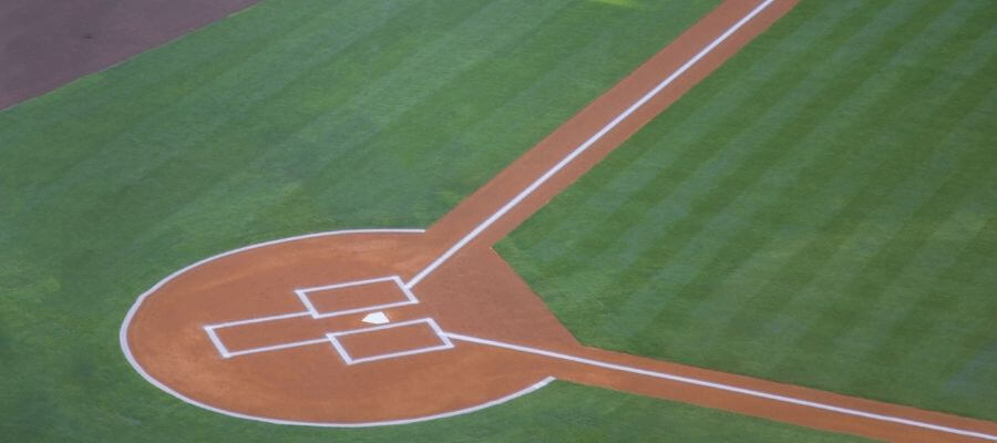 baseball field with stripes in the grass